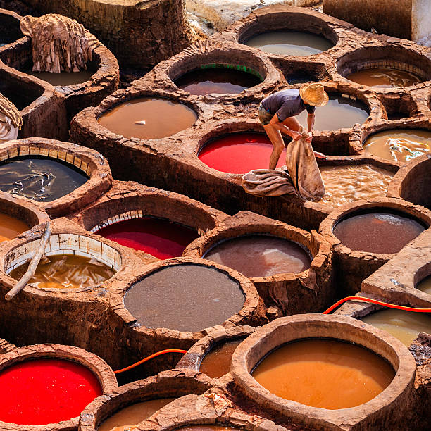 istock Man working in the tannery, Fez, Morocco 472178567