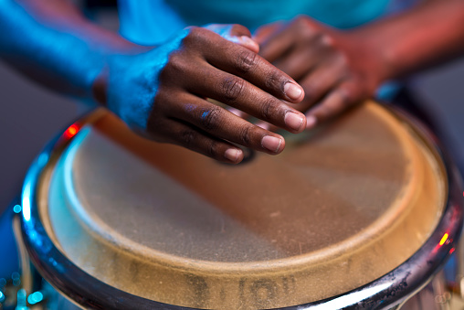 Close up of man hand's playing on drum