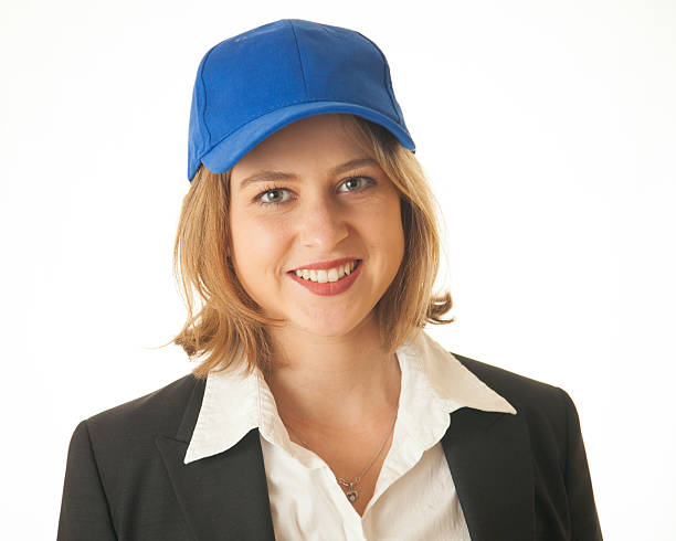 Business Coach Head and shoulders image of a female business coach woman wearing baseball cap stock pictures, royalty-free photos & images
