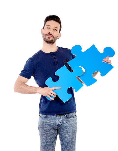 istock matching puzzle pieces in man hands 472179470