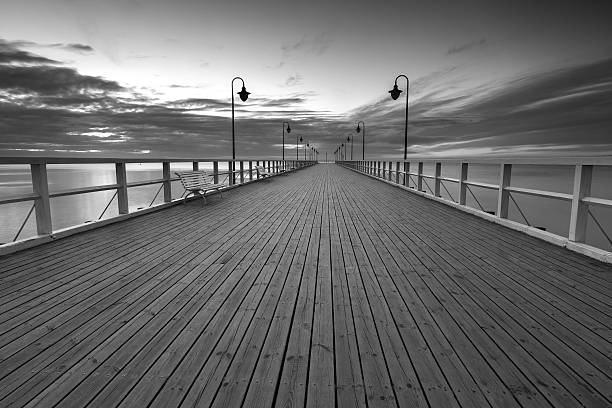 istock Beautiful long exposure seascape with wooden pier 472180142