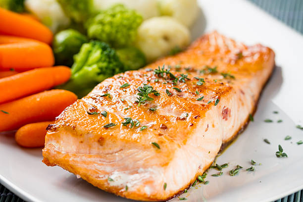 istock Fillet of salmon with mixed vegetables 472180233