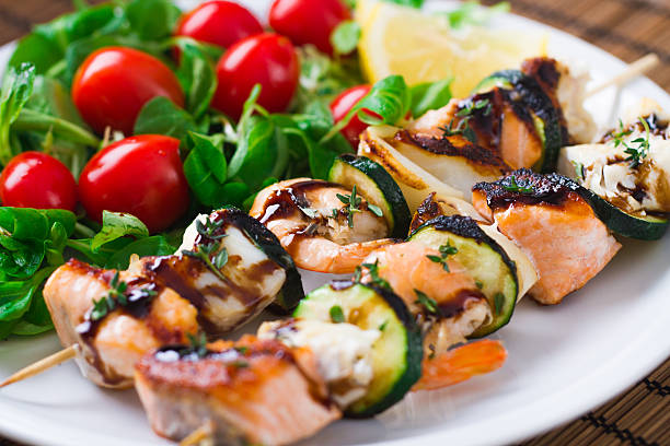istock Fish skewers with salad 472182005