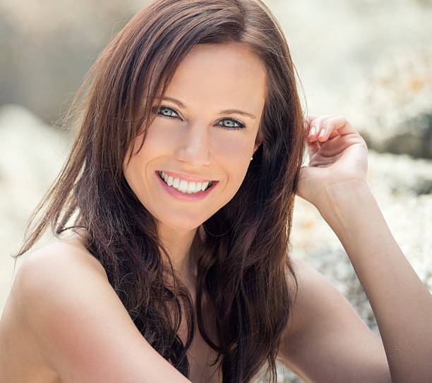 Natural mature beauty enjoying her holidays at the beach. Natural pose, smile and perfect candid expression! Nikon D800e. Converted from RAW. (XXXL)