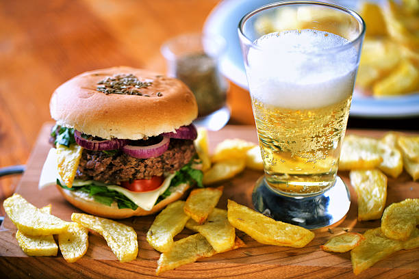 istock Fresh hamburger with beer and fried potatoes 472182501