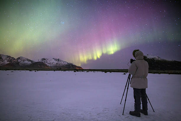istock Photographer in front of breathtaking aurora 472183253