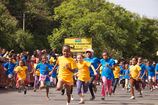 Addis Ababa,Ethiopia - May 13, 2012 : The children are running in the Europe Day Children Race at Cape Verde Street in Addis Ababa.