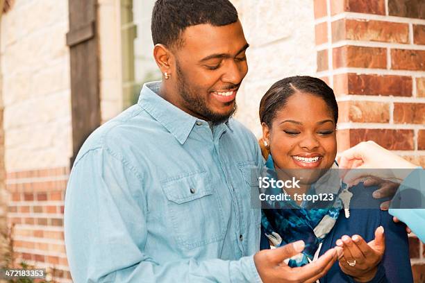 Real Estate African Descent Couple Buys Home House Key Real Estate Agent Stock Photo - Download Image Now