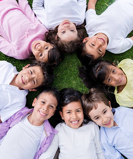 istock Group of kids in a circle 472184449