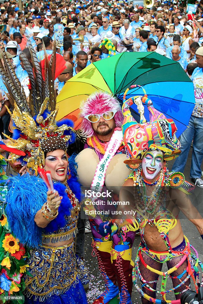 Ipanema band parading in Rio Rio de Janeiro, Brazil - February 19, 2011: Ipanema Band starts its traditional parade in Gomes Carneiro Street in Ipanema. Drag queens in front of the musicians. Rio Carnival Stock Photo