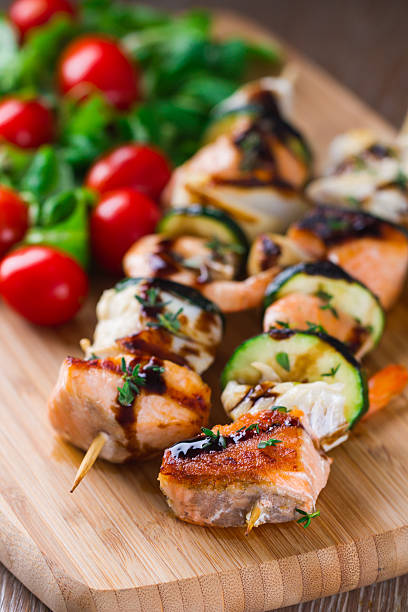 istock Fish skewers with salad 472185057