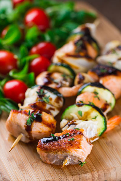 istock Fish skewers with salad 472185721