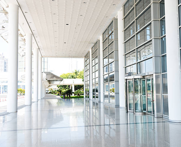 istock Shiny modern office lobby with a revolving door 472185837