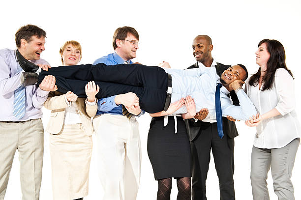 istock Business team with their colleague on hands 472186577