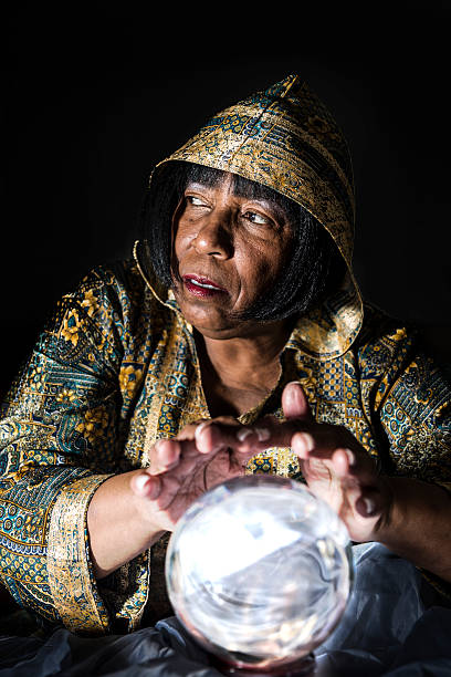 Fortune Teller Gazing into Her Crystal Ball stock photo