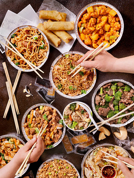 Chinese Take Out A huge Meal of All Your Favorite Chinese Foods -Photographed on Hasselblad H3D2-39mb  chinese food photos stock pictures, royalty-free photos & images