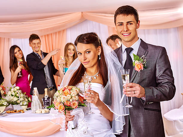 istock Wedding couple drinking champagne 472188498