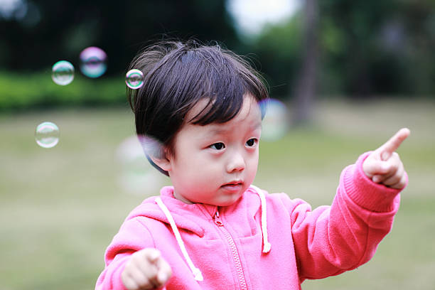 istock Cute children playing in the park 472191265