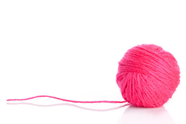 istock Pink Yarn Ball  on white background 472192515