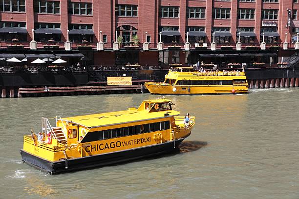 Chicago Water Taxi Chicago, United States - June 27, 2013: People ride Chicago Water Taxi on June 27, 2013 in Chicago. Water Taxi along Chicago River is important part of public transportation in US 3rd most populous city. watertaxi stock pictures, royalty-free photos & images