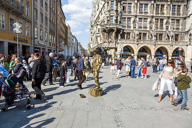 Munich, Germany - April 7, 2009: street pantomime at the marienplatz in Munich earns money as a typical bavarian rural old person in Munich , Germany.