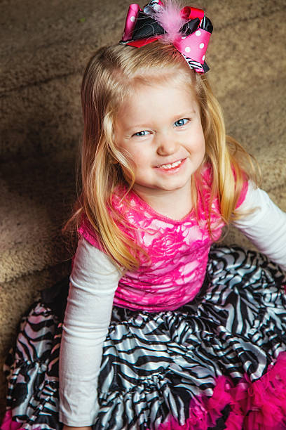 istock 3-Year-Old Smiles with Mischief in Her Eye 472198249