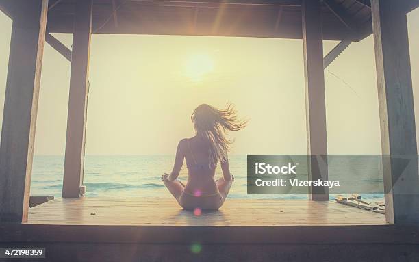 Yoga Meditation At Sunset Stock Photo - Download Image Now - Chakra, Women, One Woman Only