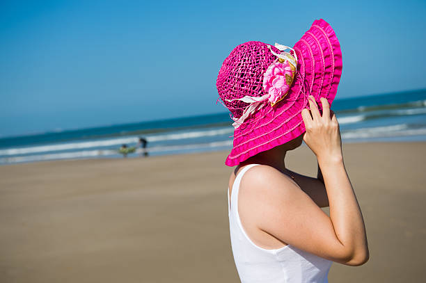 istock woman in summer hat 472199647