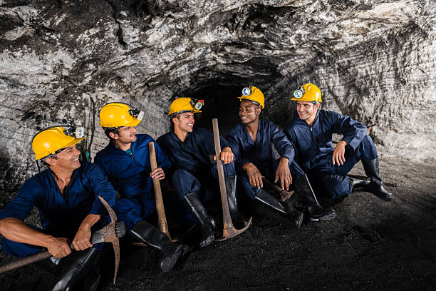 istock Group of miners talking 472200015