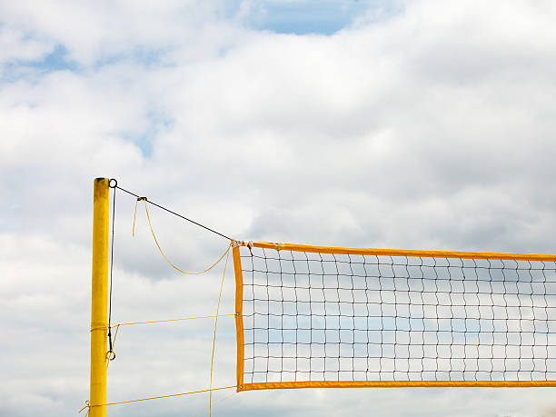 istock Volleyball summer sport. Net on a sandy beach 472200020
