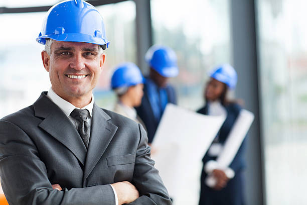 istock senior construction manager with arms crossed 472201855