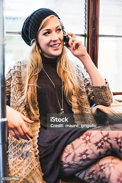 Woman Using Mobile Phone Inside The Tram Stock Photo - Download Image Now - 20-29 Years, 30-39 Years, Activity