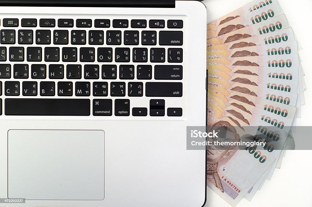 laptop keyboard and money laptop keyboard and money, Thai baht Business Stock Photo