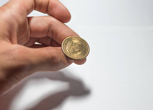 istock Flipping a US Dollar Coin 472203024