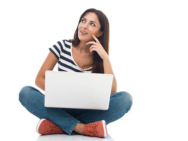 istock Young beautiful woman using laptop 472203257