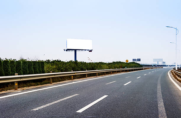 istock Commercial blank billboard besides the high-way 472203369