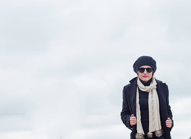 istock woman in black 472203508