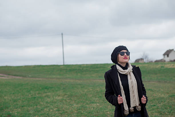 istock woman in black 472203574