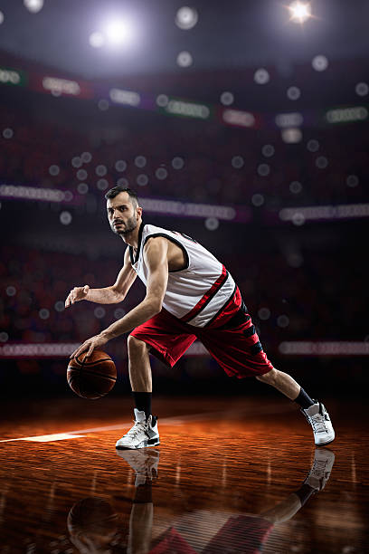 istock red Basketball player in action 472203768