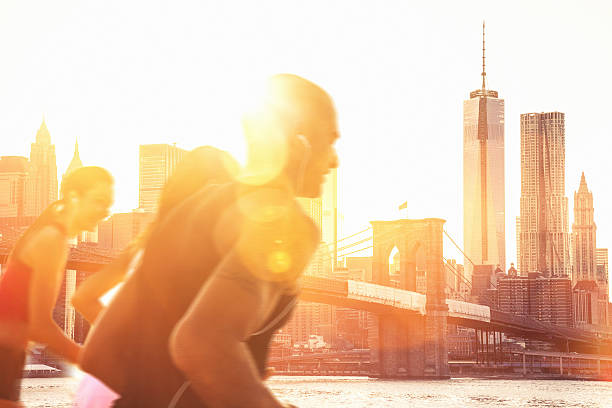 istock Three friends running in New York City 472204555