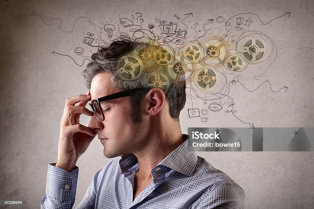 mental cogs a man is thinking hard Toughness Stock Photo