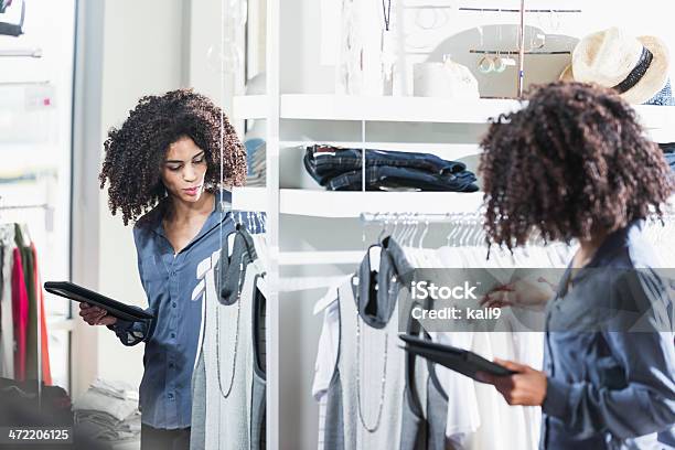 Woman In Boutique With Digital Tablet Stock Photo - Download Image Now - Technology, Retail, Shopping