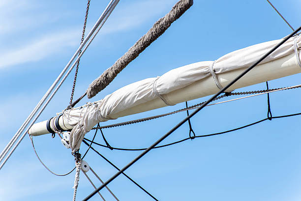istock sailboat masts, rigging and rolled up sails 472207072
