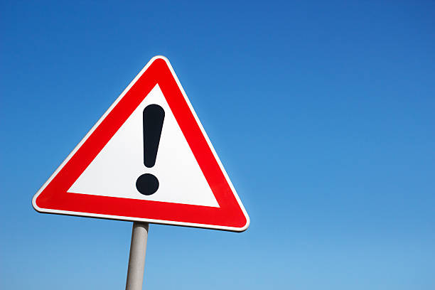 Warning sign Warning road sign against a blue sky. road warning sign photos stock pictures, royalty-free photos & images