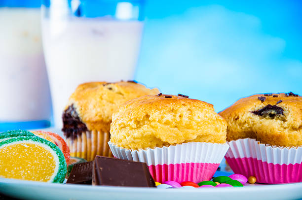 istock Vivid theme of sweets with bright blue background 472208459