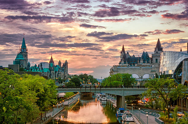 Rideau Canal at Sunset Rideau Canal (UNESCO) at Sunset with Chateau Laurier in background parliament hill ottawa stock pictures, royalty-free photos & images