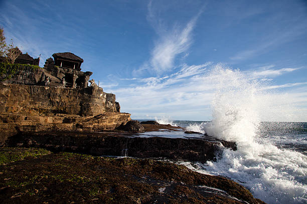 Waves break aginst Tanah Lot stock photo