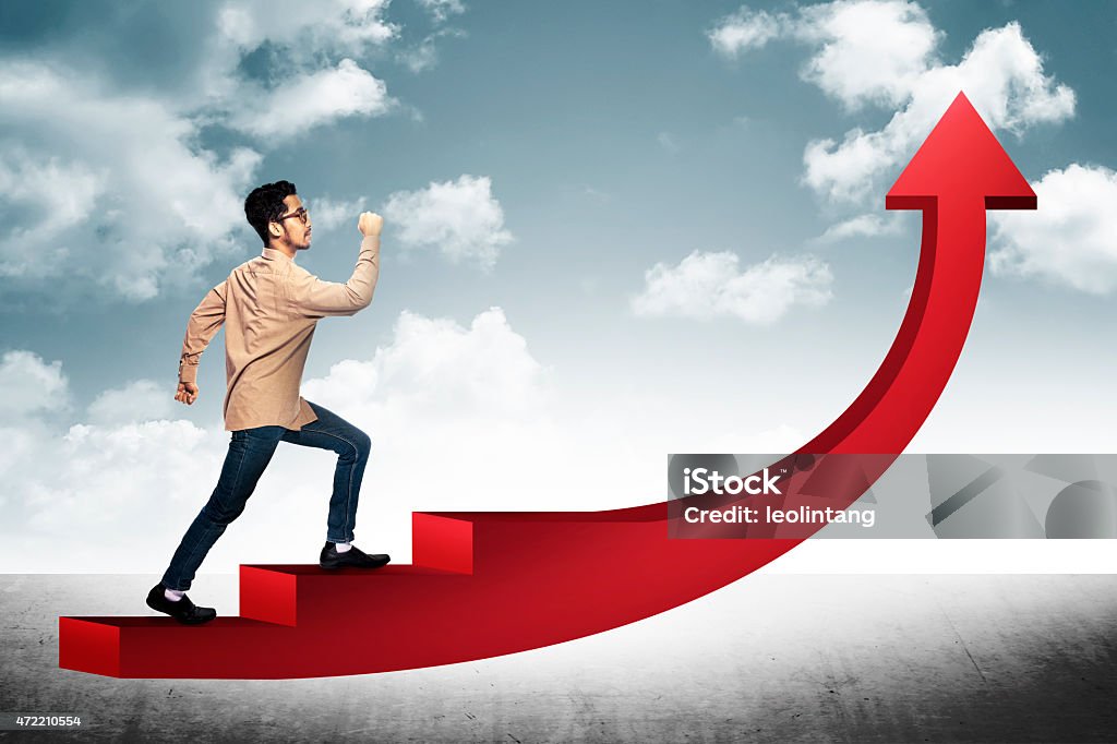 Business Man Step On Red Arrow Conceptual Image. Business man step on stair with red arrow shape going up Clambering Stock Photo