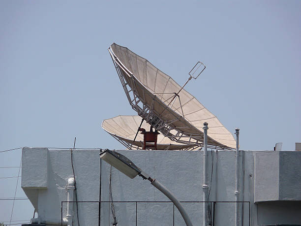 istock Dish antennas are fitted on terrace at different angles 472210701