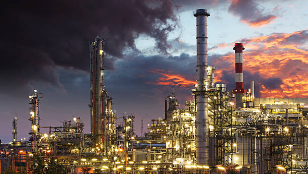 istock Steel oil refineries, with gray clouds and orange sky 472210755